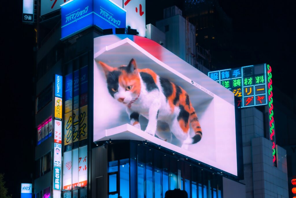 夜の新宿LEDビジョン猫の風景